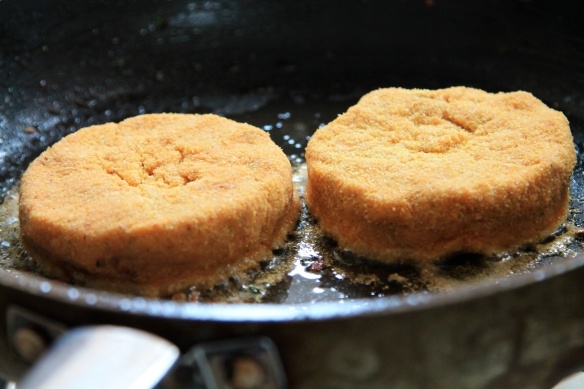 Chickpea cakes frying